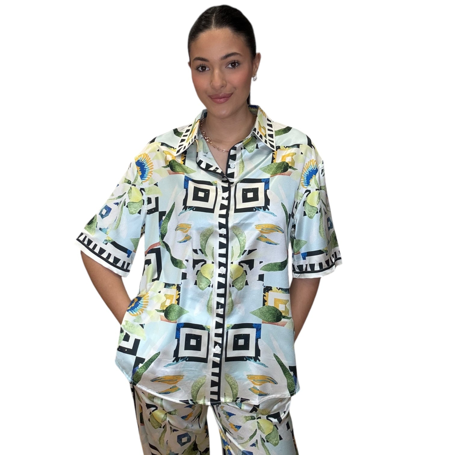 Satin sky button-down shirt and wide-leg pants set in colorful print, model showcasing relaxed fit and stylish design.