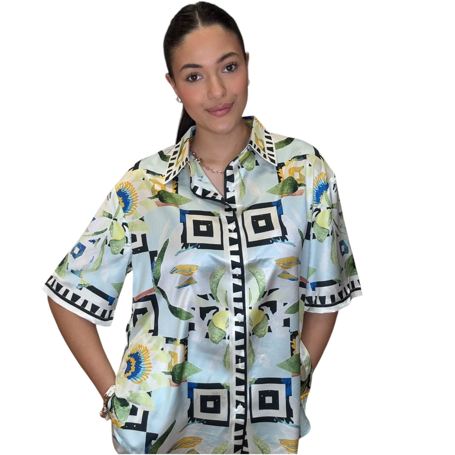 Model showcasing the Satin Sky button-down shirt featuring vibrant floral print and relaxed fit.