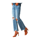 Light wash mid rise cropped flare jeans with distressed detailing and ripped knees, styled with high heel sandals.